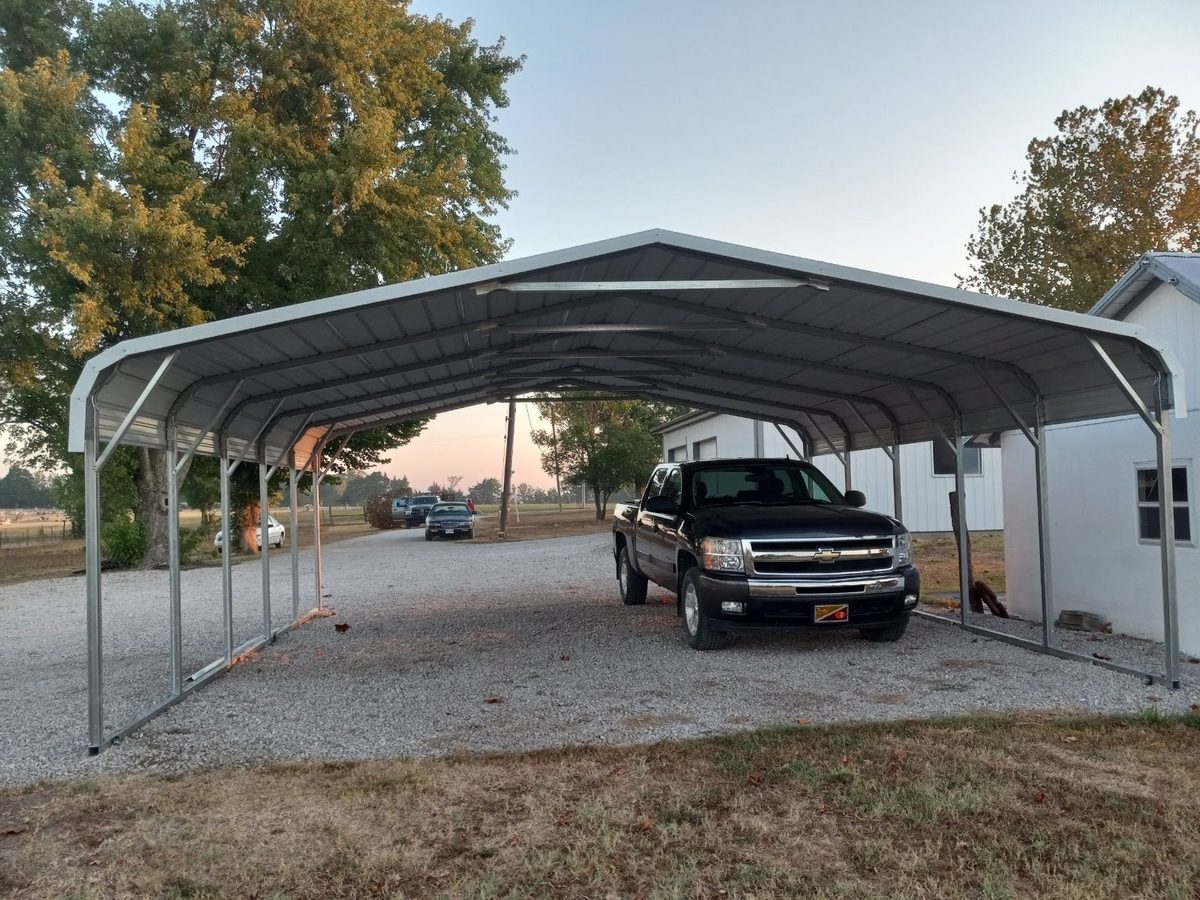 Legacy standard metal carport with a rounded roof covering a pickup truck